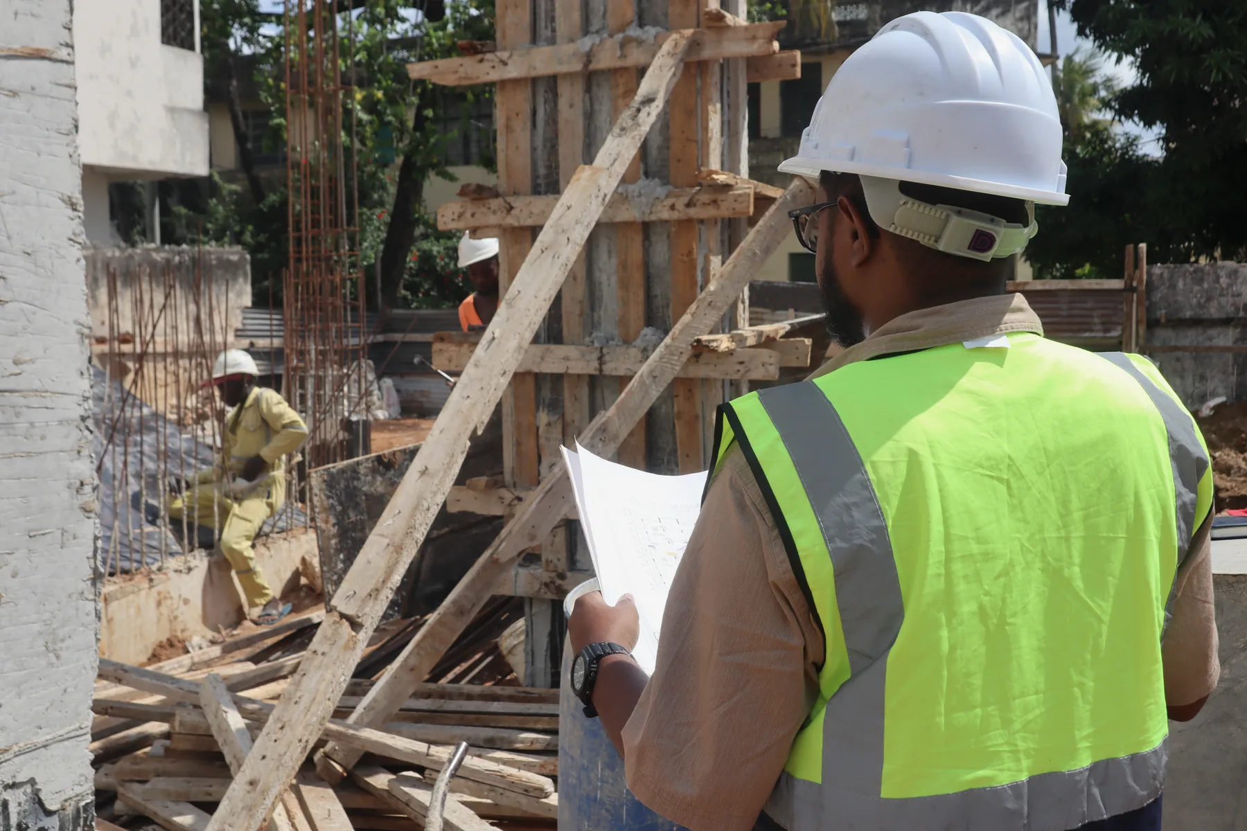Engineer carrying out an inspection on an active construction site