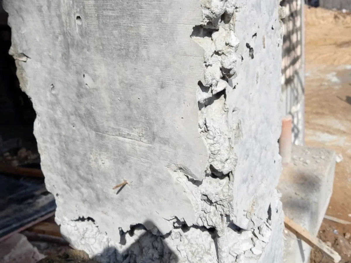 Visible concrete surface defect requiring structural assessment